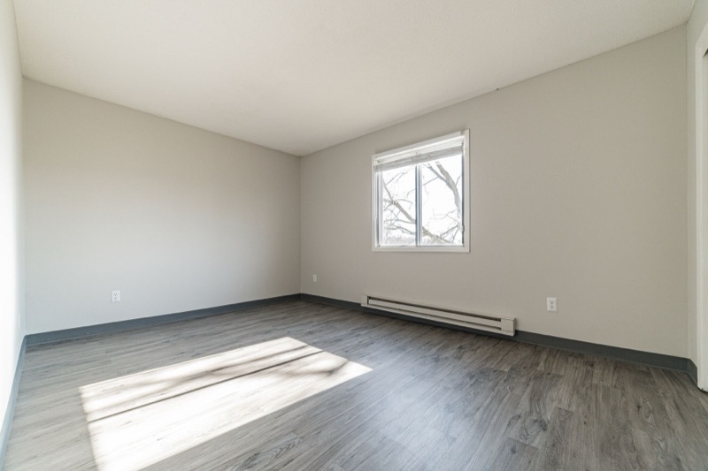 Bedroom with large window at The Ridges